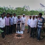 Mohan Anpat a social worker with villagers near the ground water recharge pit at Chinchani.