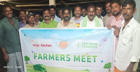 Farmers meeting to discuss advantages of organic farming